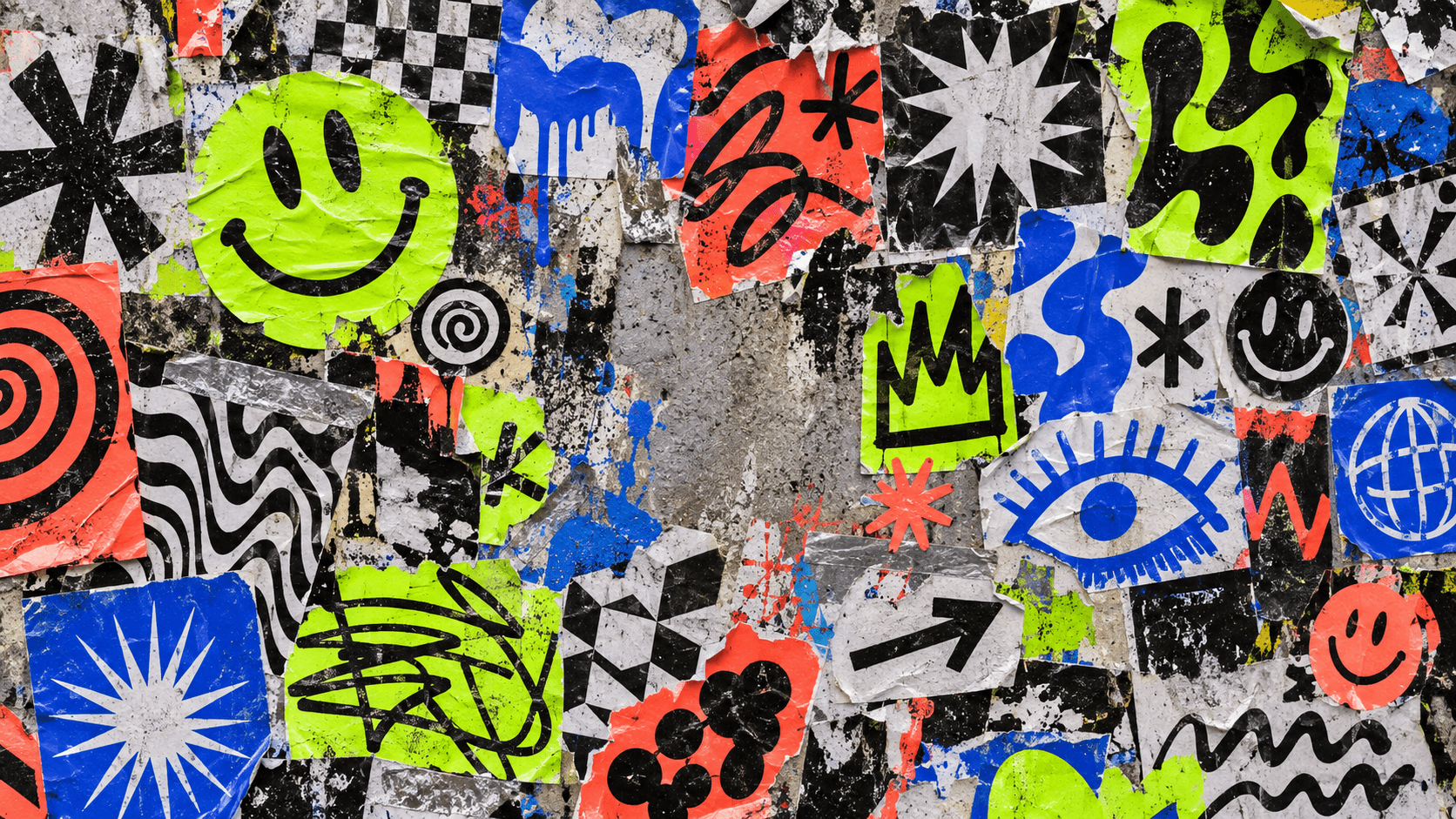 A layered graffiti sticker wall in cobalt, lime, coral, black, and white